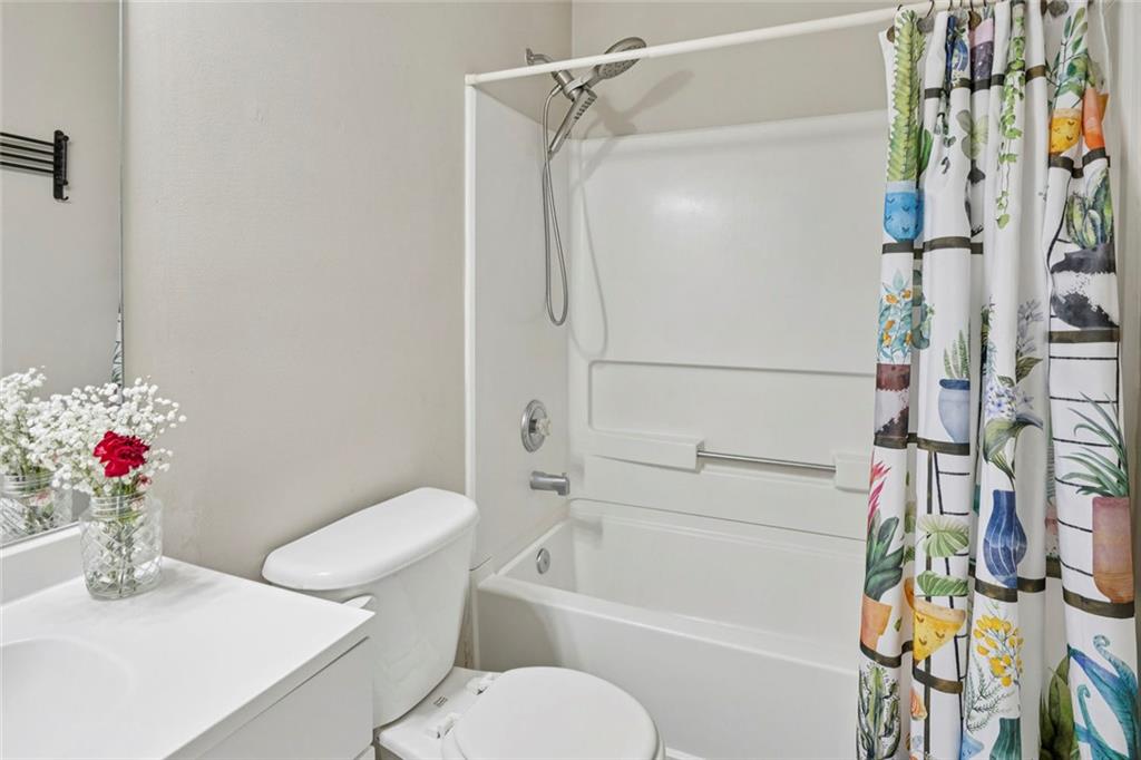 1257 Gates Circle Southeast Atlanta, GA 30316 - Photo 22 of 26 a bathroom with a sink toilet and shower