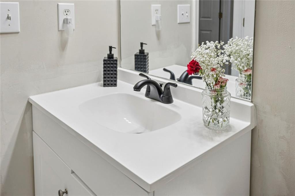 1257 Gates Circle Southeast Atlanta, GA 30316 - Photo 23 of 26 a bathroom with a sink and a mirror