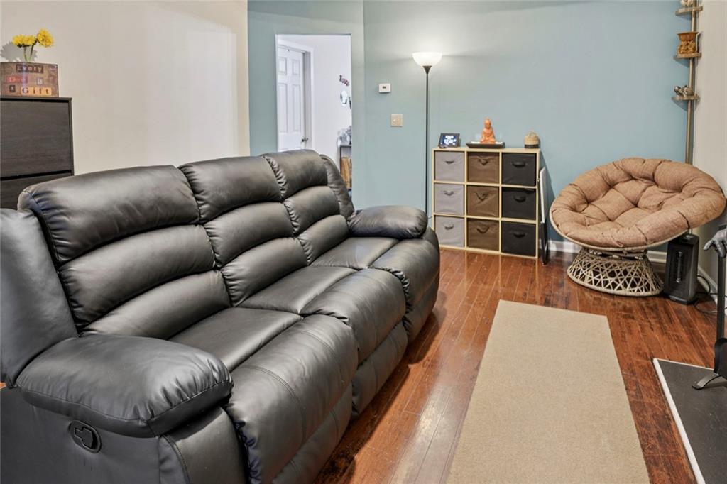 1257 Gates Circle Southeast Atlanta, GA 30316 - Photo 5 of 26 a living room with furniture a rug and white walls