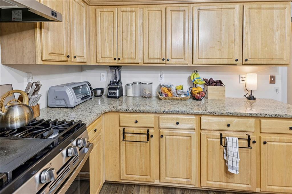 1257 Gates Circle Southeast Atlanta, GA 30316 - Photo 9 of 26 a kitchen with stainless steel appliances granite countertop a stove and cabinets