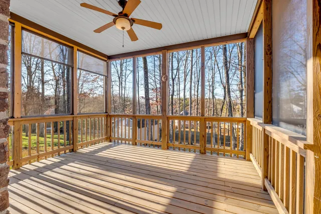 a view of a balcony with wooden floor