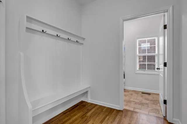a view of a room with wooden walls