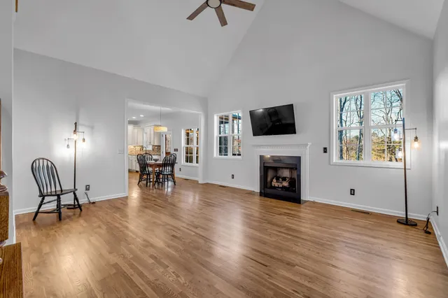a view of a livingroom with furniture and a fireplace