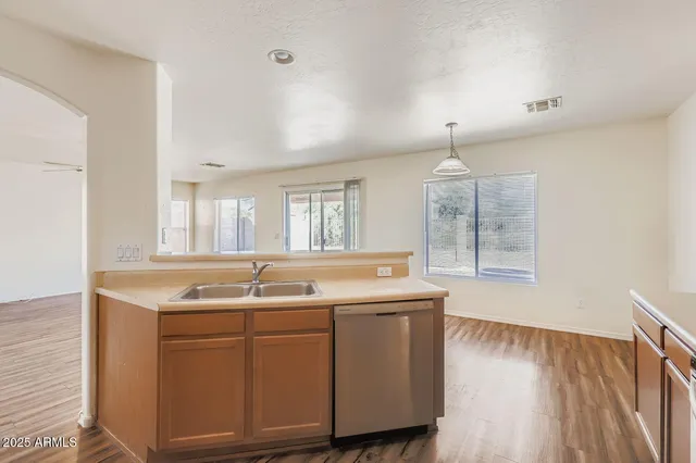 a kitchen with a sink and a window