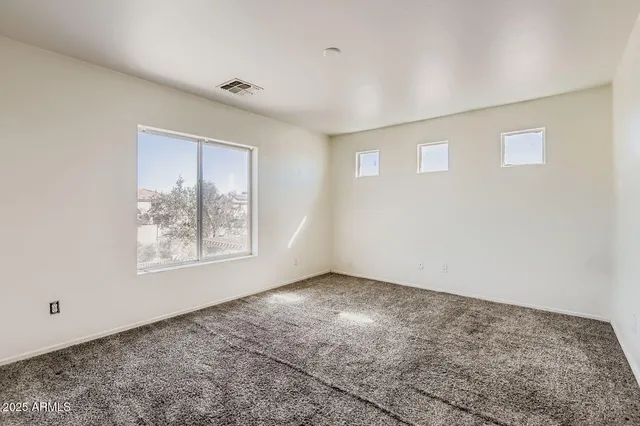 an empty room with windows