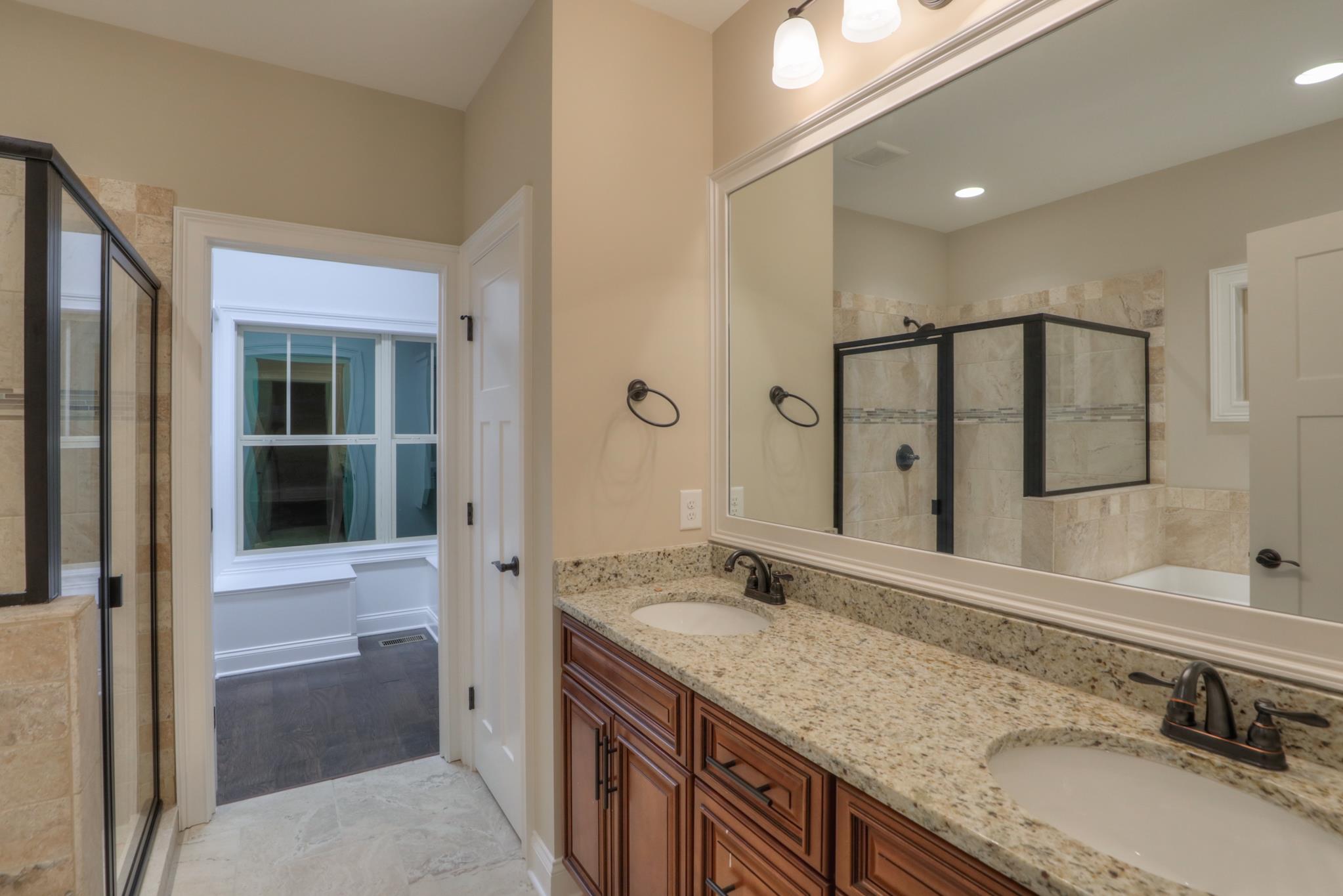 2219 Cairo Bend Road Lebanon, TN 37087 - Photo 18 of 30 a bathroom with a granite countertop sink mirror and double