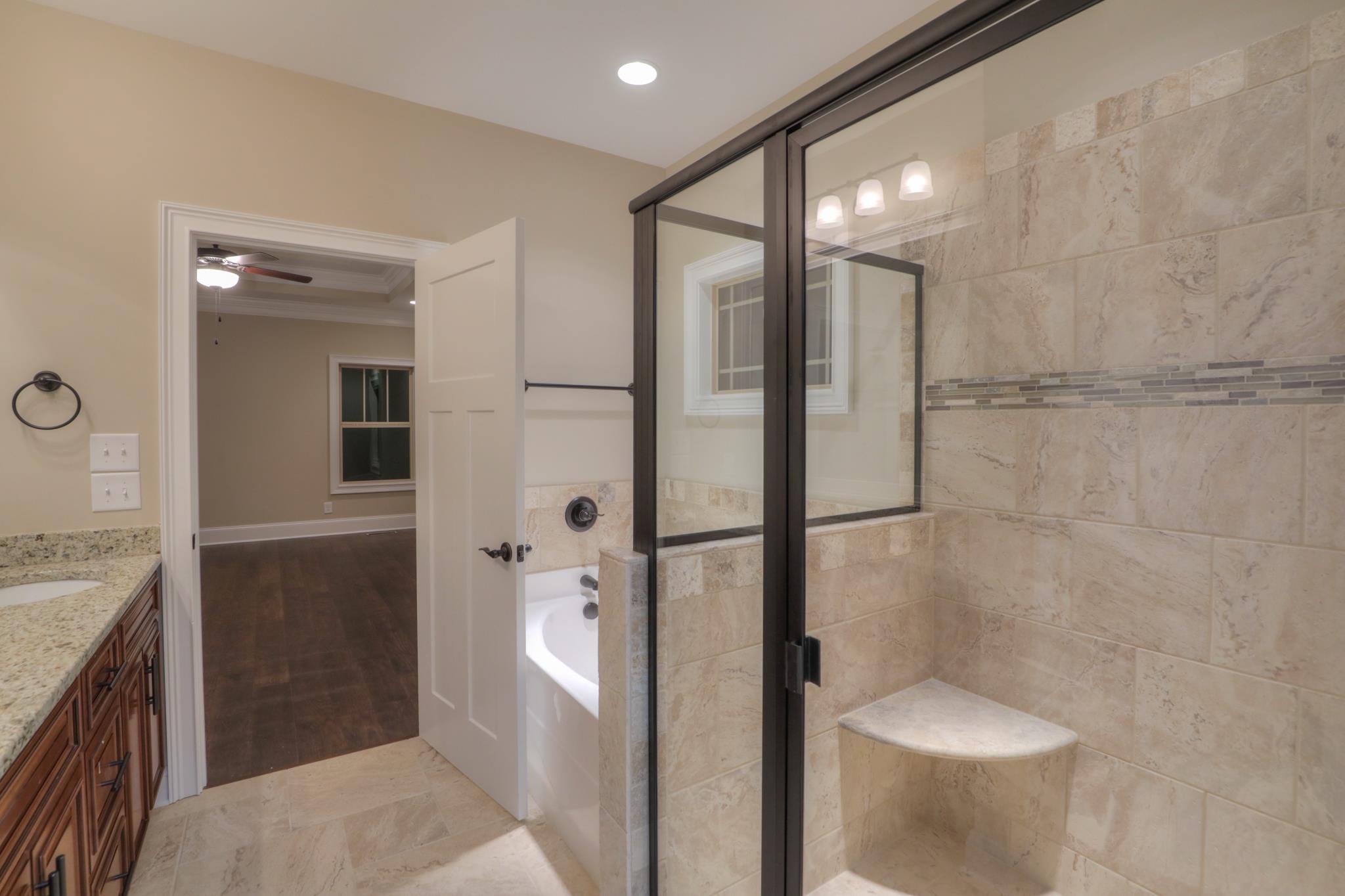 2219 Cairo Bend Road Lebanon, TN 37087 - Photo 19 of 30 a bathroom with a shower and a toilet