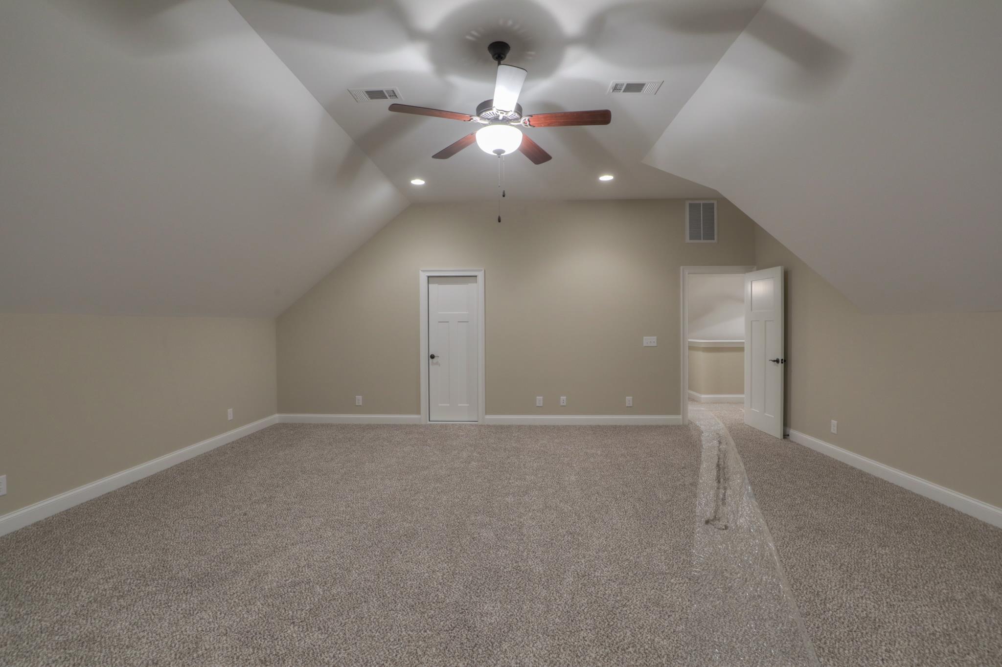2219 Cairo Bend Road Lebanon, TN 37087 - Photo 25 of 30 an empty room with a chandelier fan and window