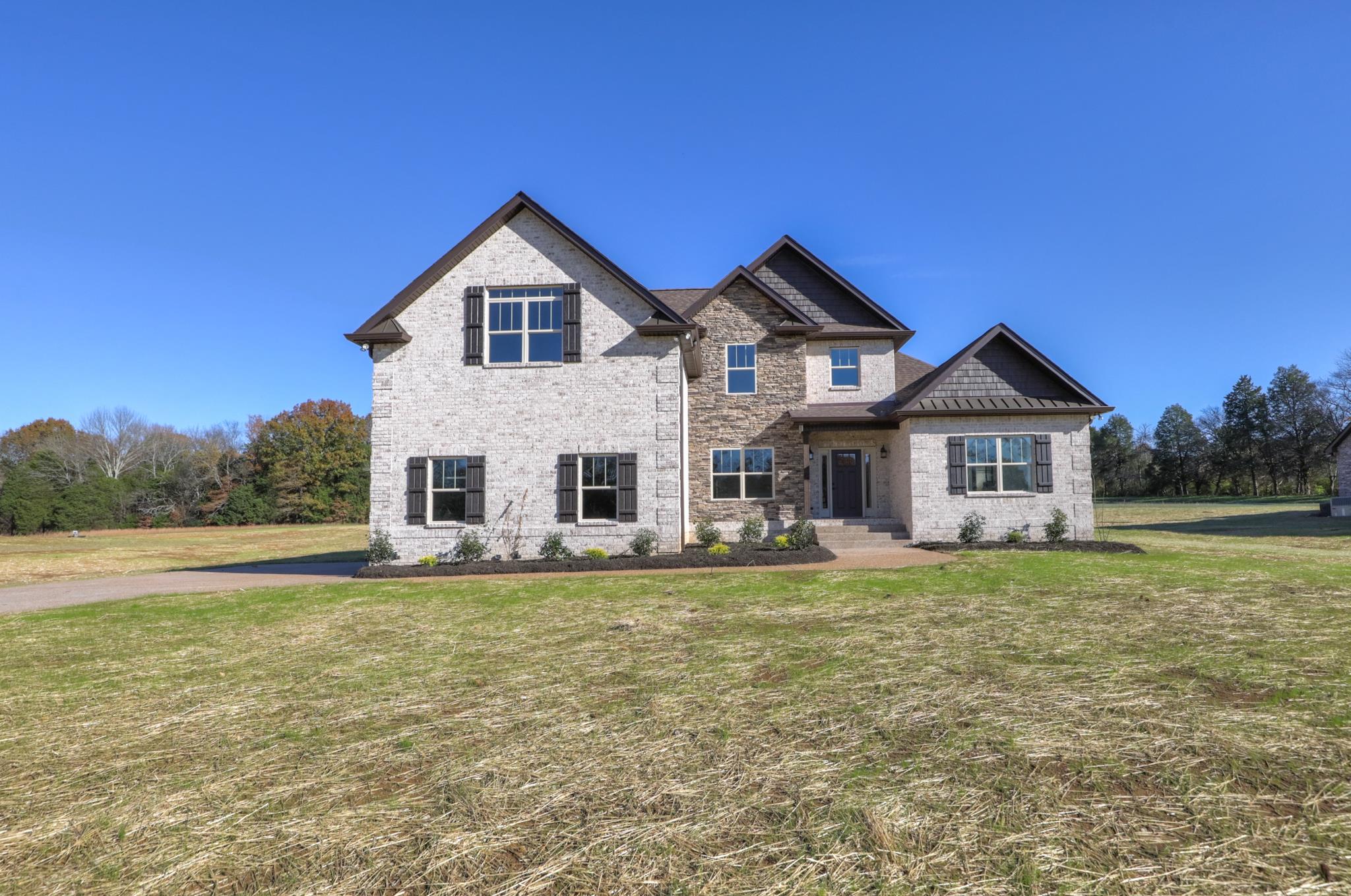 2219 Cairo Bend Road Lebanon, TN 37087 - Photo 3 of 30 a front view of a house with a yard and trees