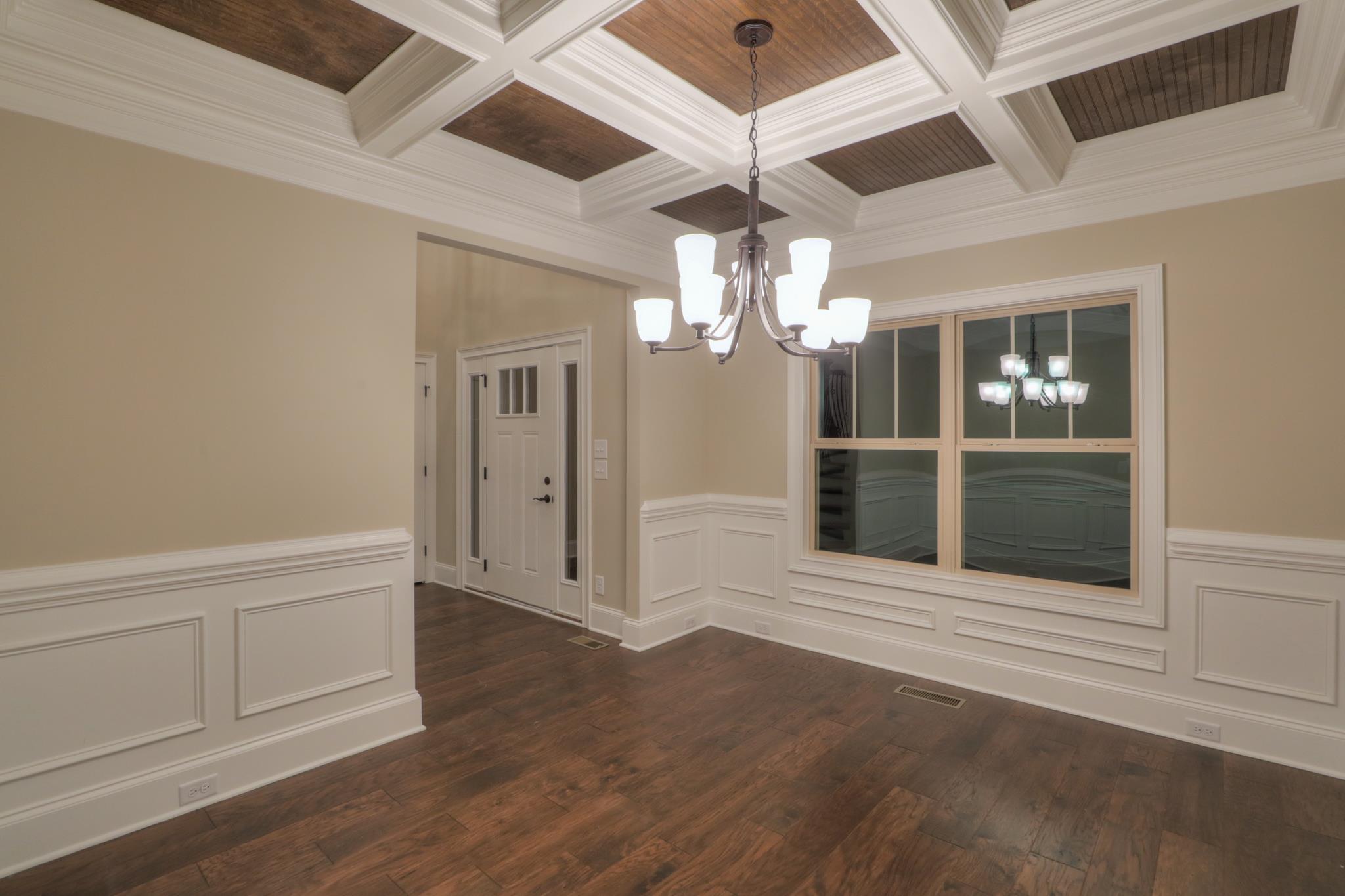 2219 Cairo Bend Road Lebanon, TN 37087 - Photo 5 of 30 an empty room with wooden floor chandelier and entryway