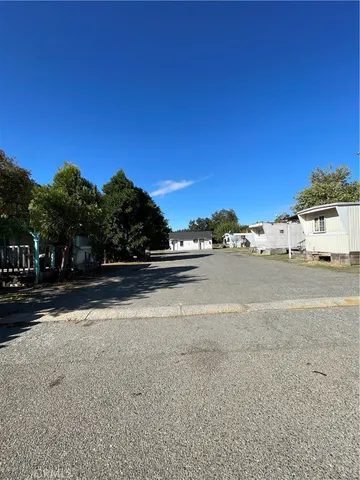 a view of ocean view with large trees