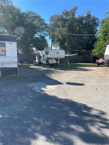 a view of street with parked cars