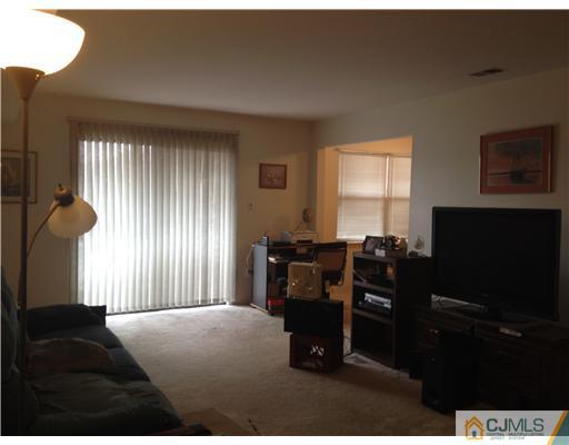 1713 Raspberry Court Edison, NJ 08817 - Photo 5 of 14 a living room with furniture and a flat screen tv
