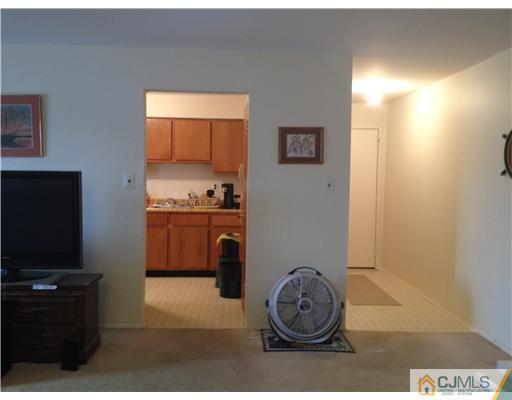 1713 Raspberry Court Edison, NJ 08817 - Photo 9 of 14 a room with a stove and a chair
