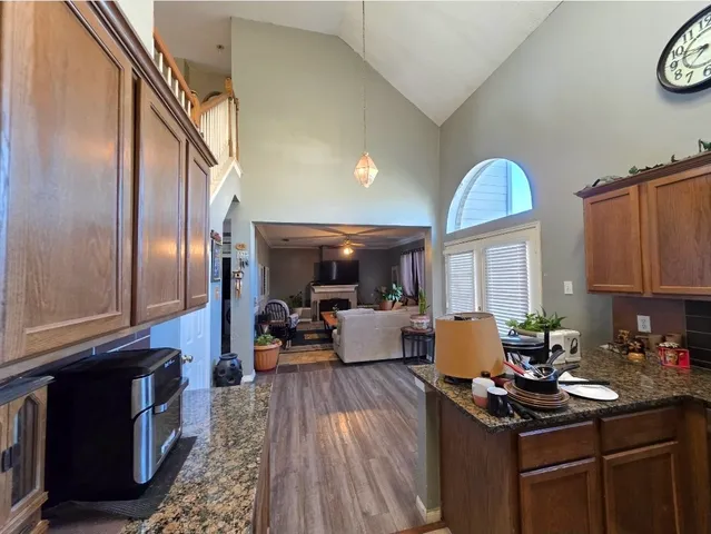 a kitchen with a sink appliances and cabinets