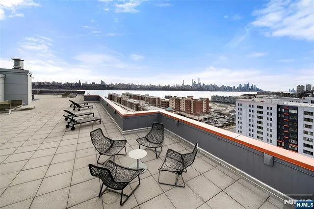 a view of a terrace with furniture and a table
