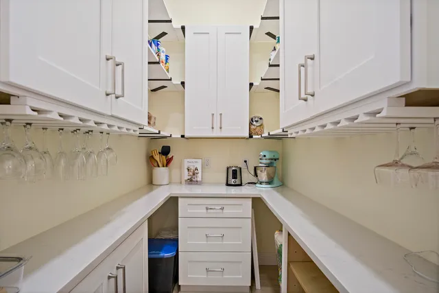 a kitchen with stainless steel appliances cabinets and a window