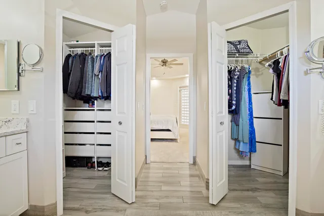 a view of walk in closet with white walls