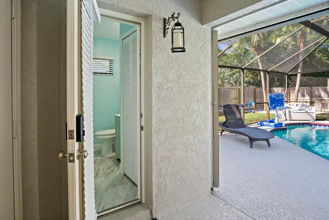 a view of a backyard with swimming pool