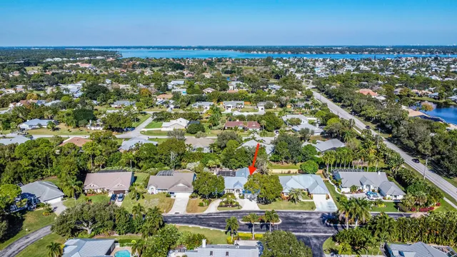an aerial view of house with yard swimming pool and outdoor seating