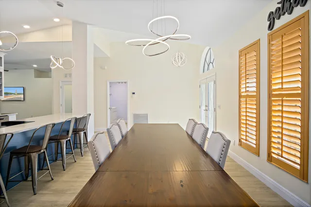 a view of a dining room with furniture and a window
