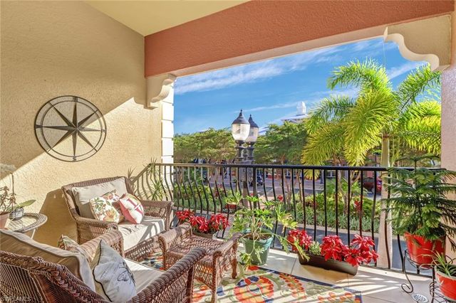 a view of a balcony with furniture