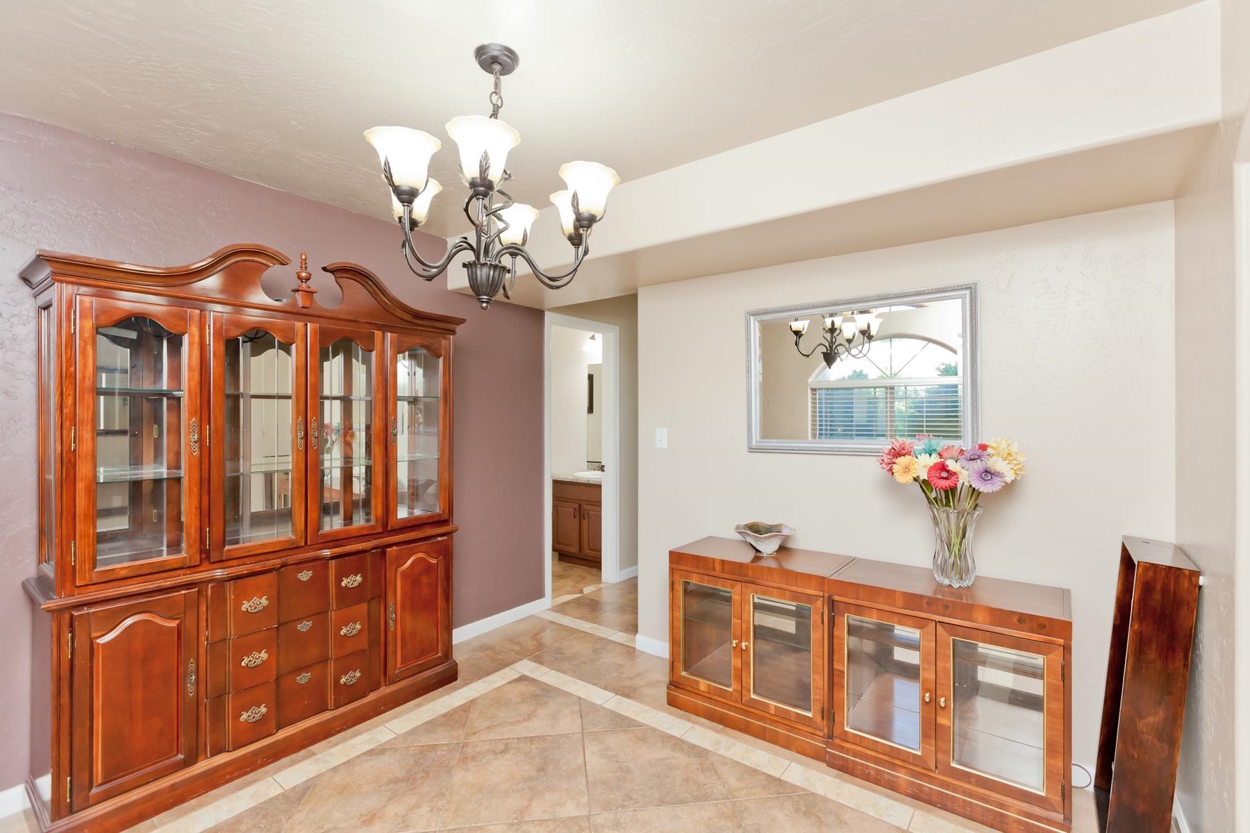 718 Sabil Drive Fruita, CO 81521 - Photo 11 of 35 a view of a dining room with furniture a chandelier and wooden floor
