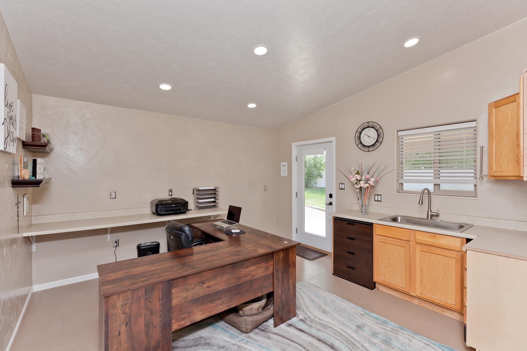 718 Sabil Drive Fruita, CO 81521 - Photo 13 of 35 a kitchen with cabinets a sink and appliances