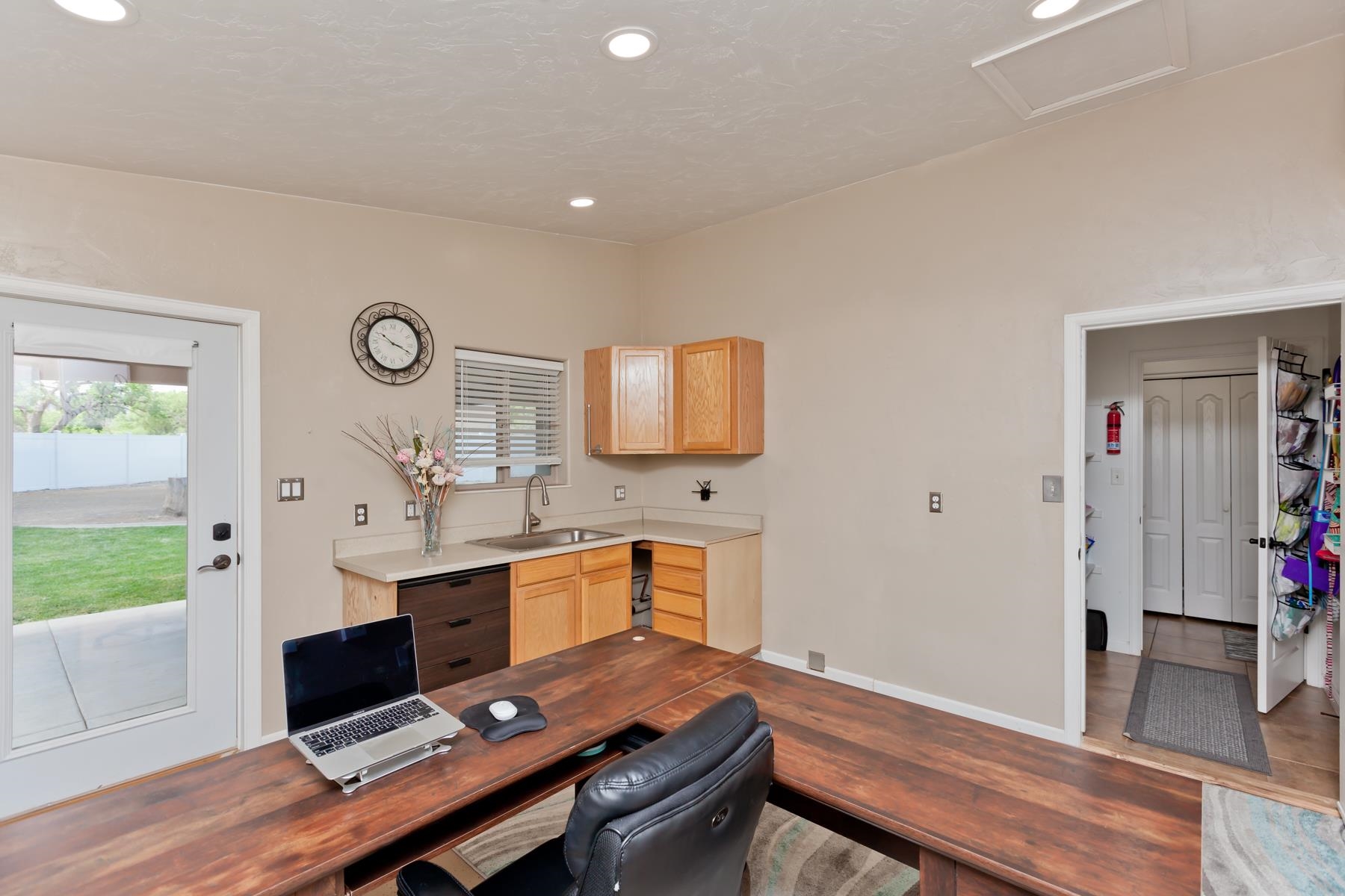 718 Sabil Drive Fruita, CO 81521 - Photo 14 of 35 a view of a workspace with furniture and wooden floor