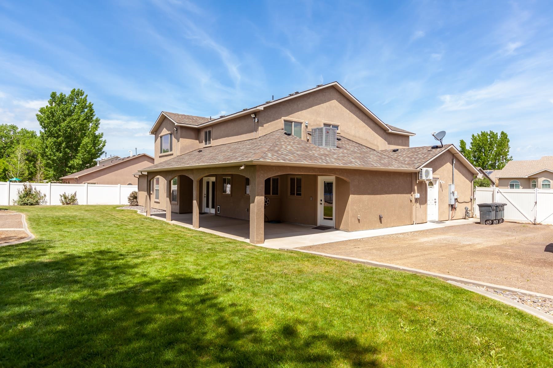 718 Sabil Drive Fruita, CO 81521 - Photo 28 of 35 a front view of a house with a garden and yard