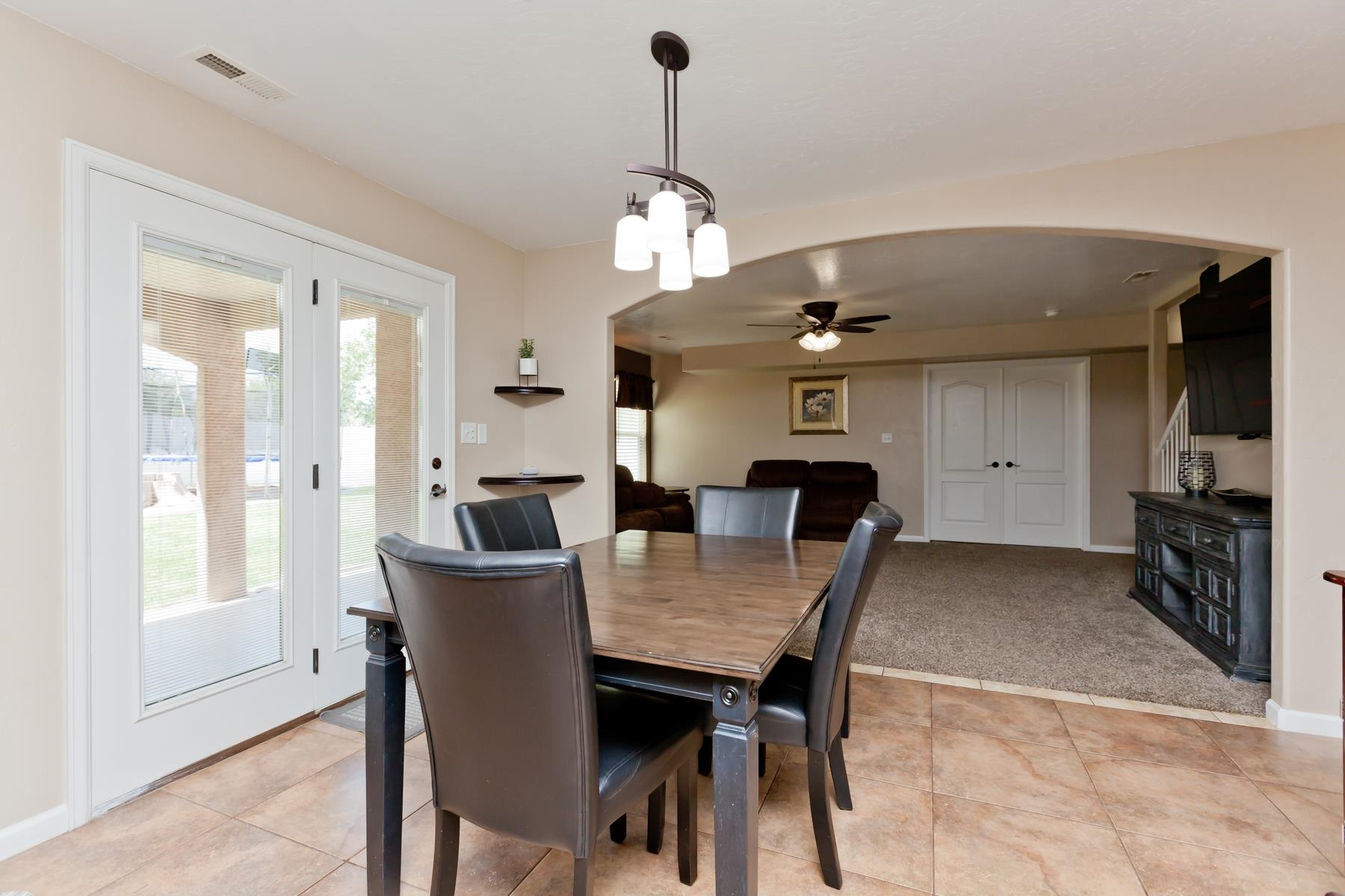 718 Sabil Drive Fruita, CO 81521 - Photo 6 of 35 a view of a dining room with furniture window and wooden floor