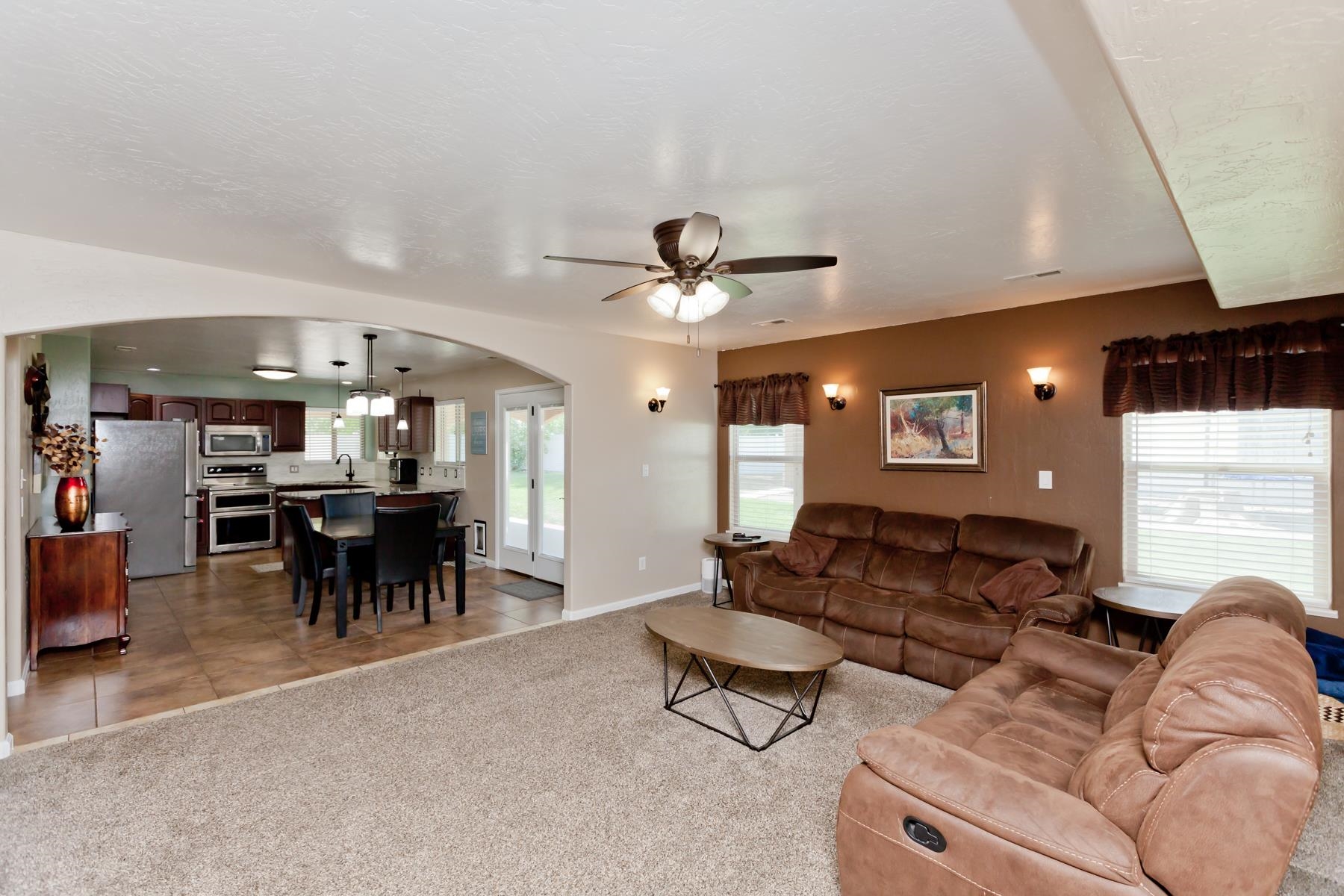 718 Sabil Drive Fruita, CO 81521 - Photo 9 of 35 a living room with furniture and a large window