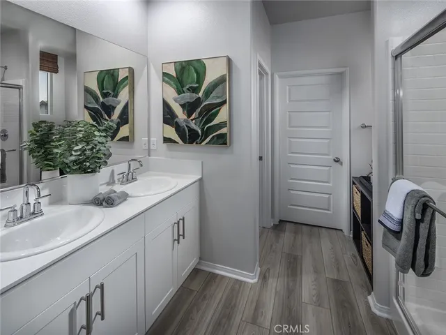a bathroom with a sink a mirror a vanity and window