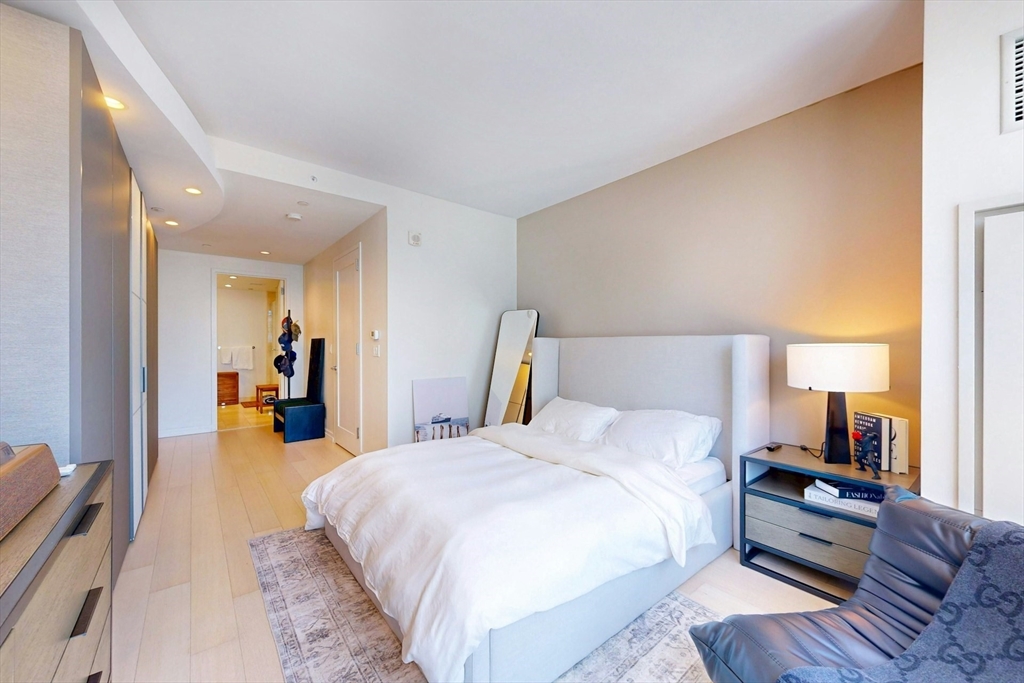 1 Franklin Street, Unit 2308 Boston, MA 02110 - Photo 18 of 41 a bed room with a bed and a television