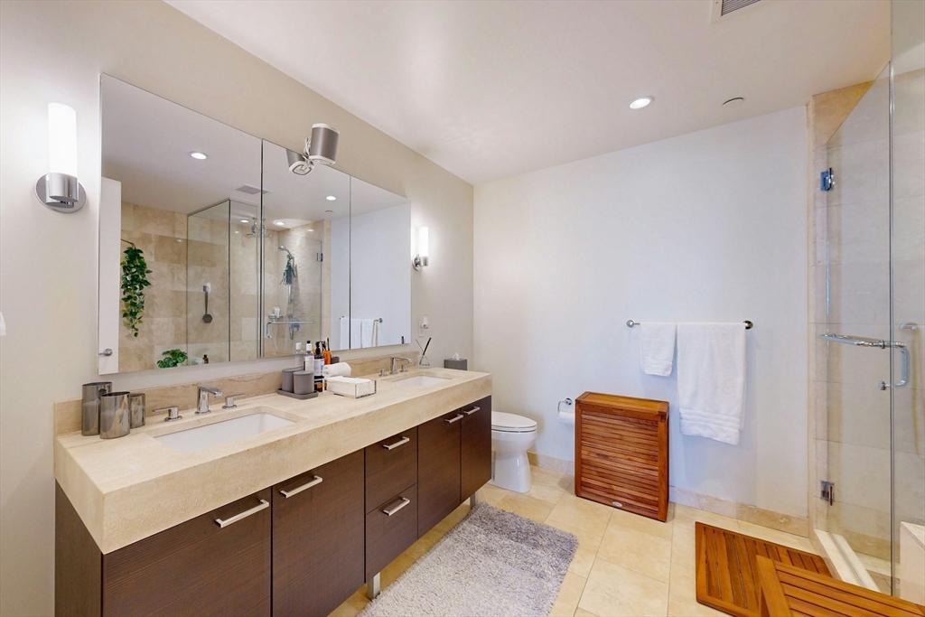 1 Franklin Street, Unit 2308 Boston, MA 02110 - Photo 19 of 41 a bathroom with a sink double vanity and a mirror