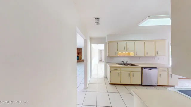 a kitchen with a stove top oven sink and cabinets