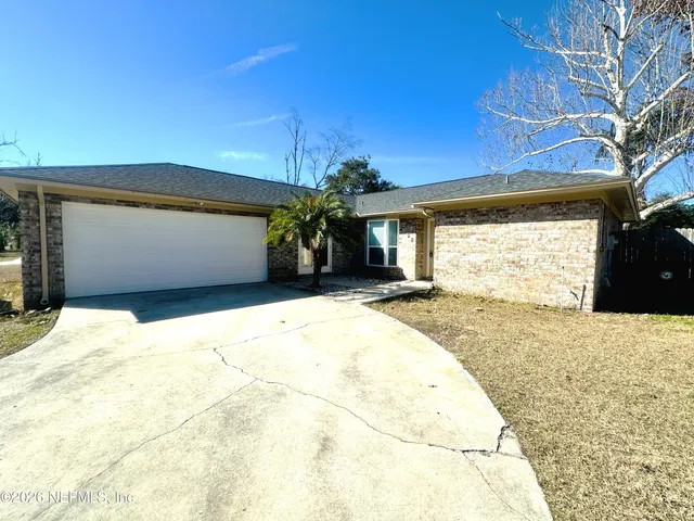 a view of a backyard of the house