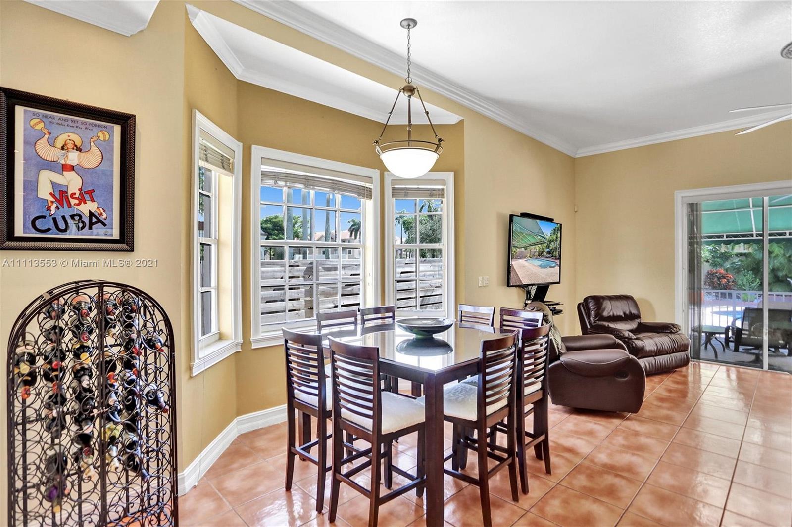 15816 Southwest 103rd Lane Miami, FL 33196 - Photo 13 of 49 a dining room with furniture and window