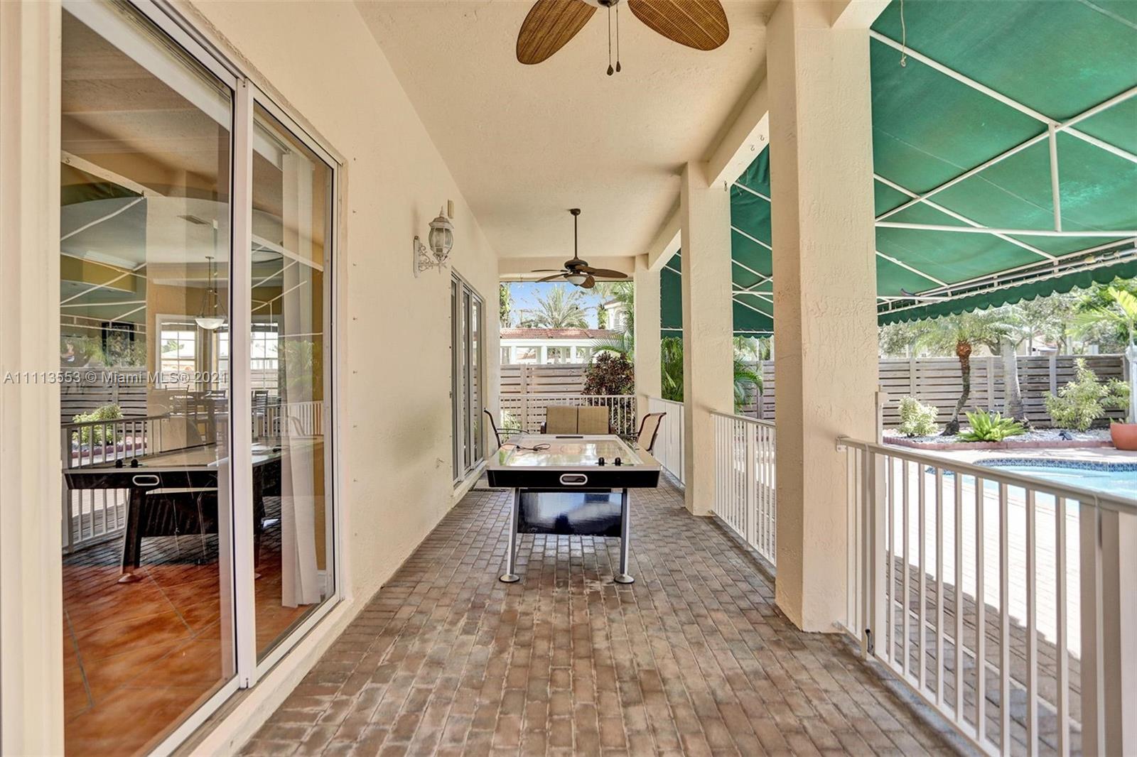 15816 Southwest 103rd Lane Miami, FL 33196 - Photo 14 of 49 a window and chairs in the balcony