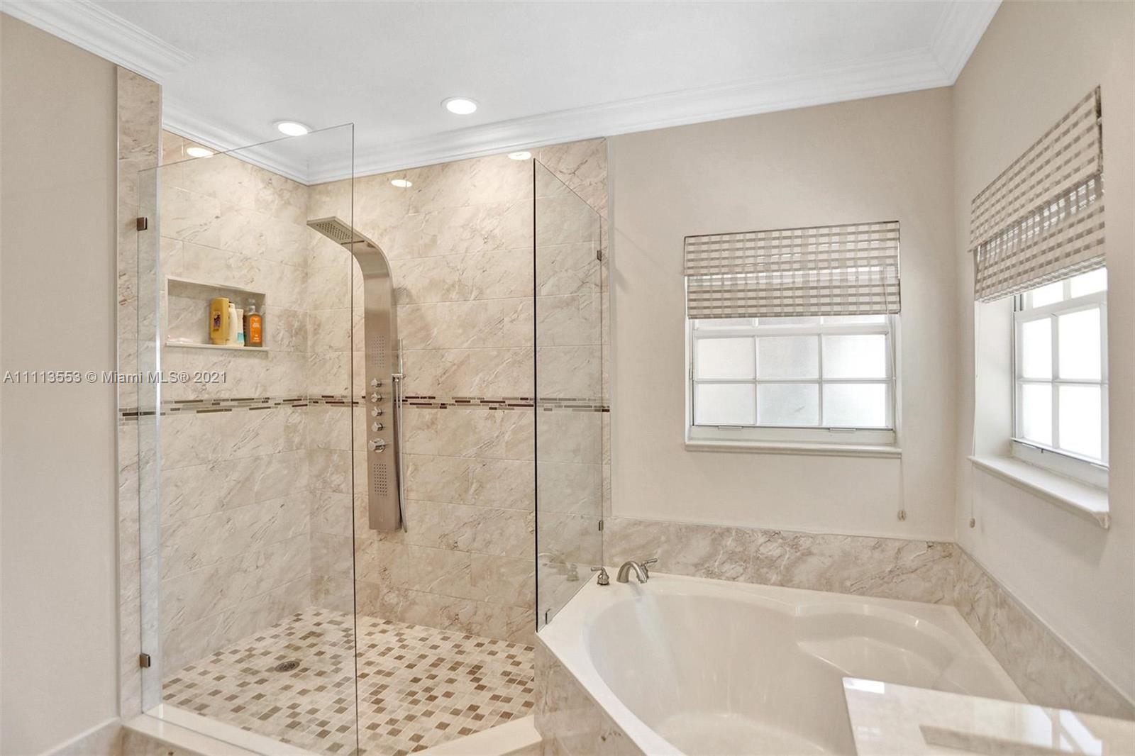 15816 Southwest 103rd Lane Miami, FL 33196 - Photo 20 of 49 a bathroom with a bathtub and a shower