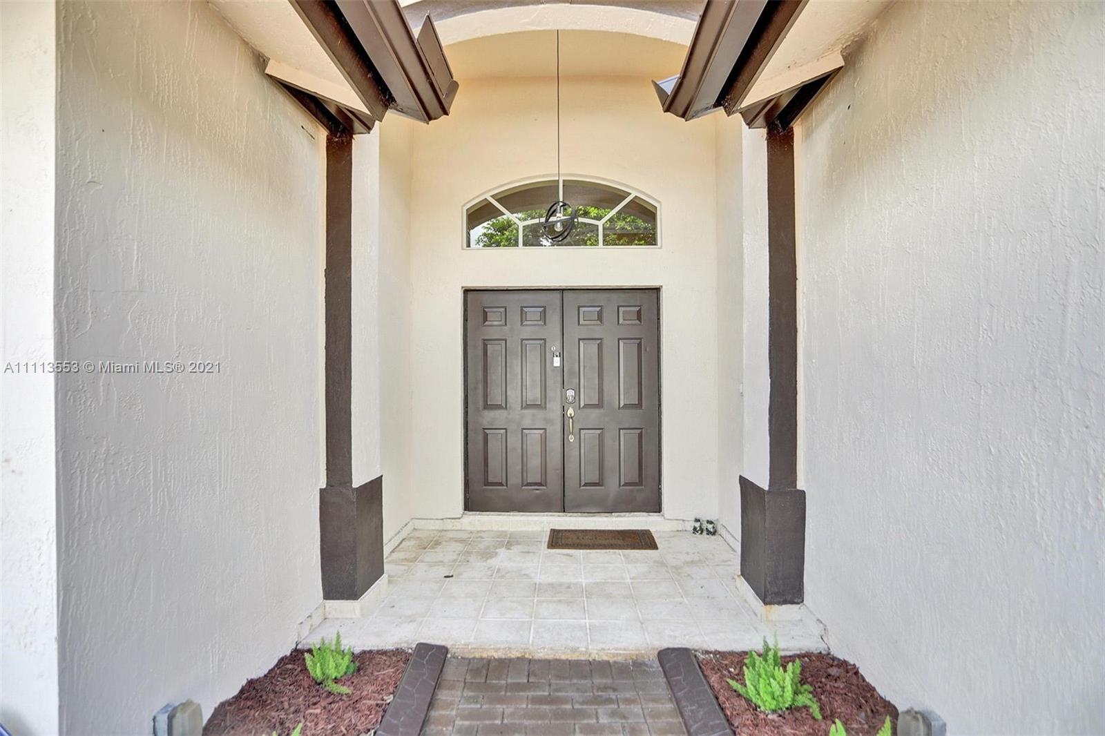 15816 Southwest 103rd Lane Miami, FL 33196 - Photo 3 of 49 a view of front door of house
