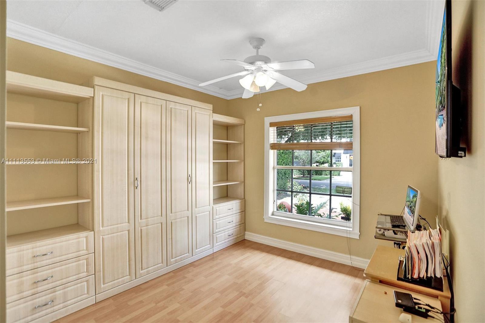15816 Southwest 103rd Lane Miami, FL 33196 - Photo 29 of 49 a view of a livingroom with a window and a ceiling fan