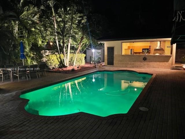15816 Southwest 103rd Lane Miami, FL 33196 - Photo 33 of 49 a view of a swimming pool with a yard