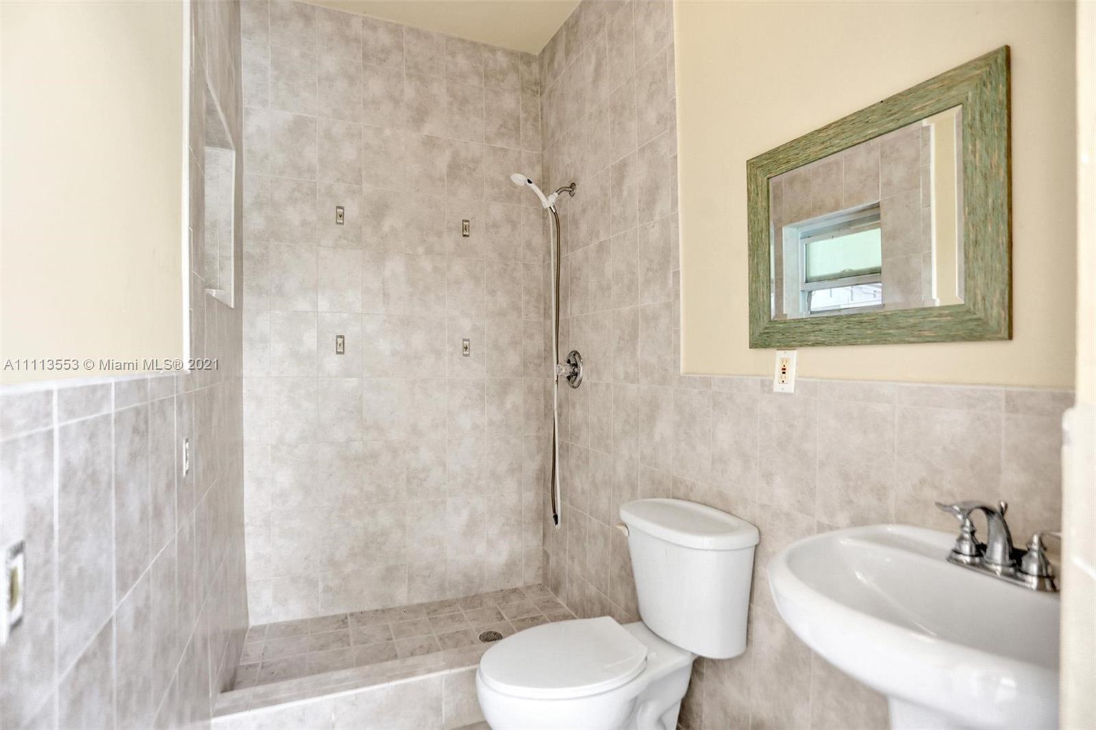 15816 Southwest 103rd Lane Miami, FL 33196 - Photo 37 of 49 a bathroom with a toilet sink and shower