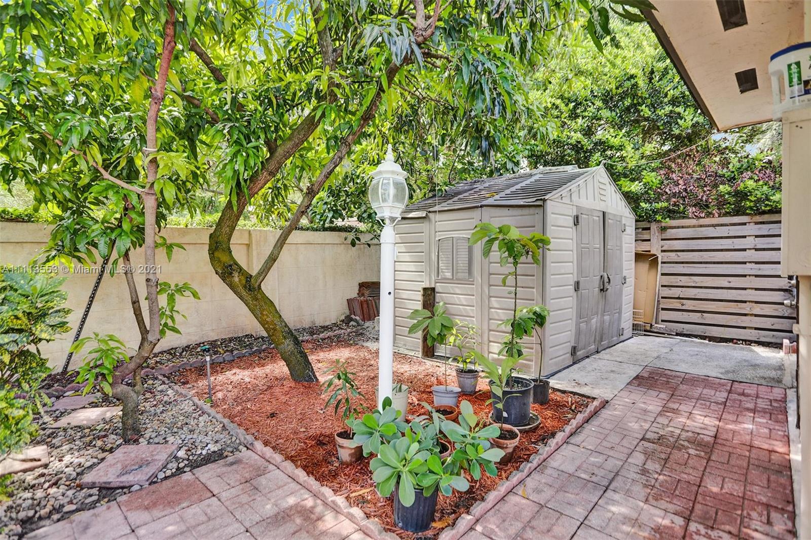 15816 Southwest 103rd Lane Miami, FL 33196 - Photo 41 of 49 a view of a house with backyard and sitting area