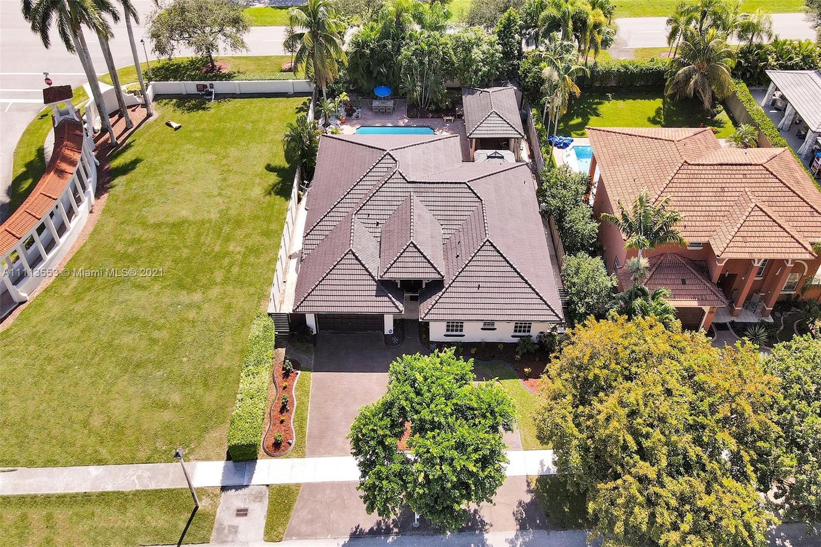 15816 Southwest 103rd Lane Miami, FL 33196 - Photo 44 of 49 an aerial view of residential house with swimming pool