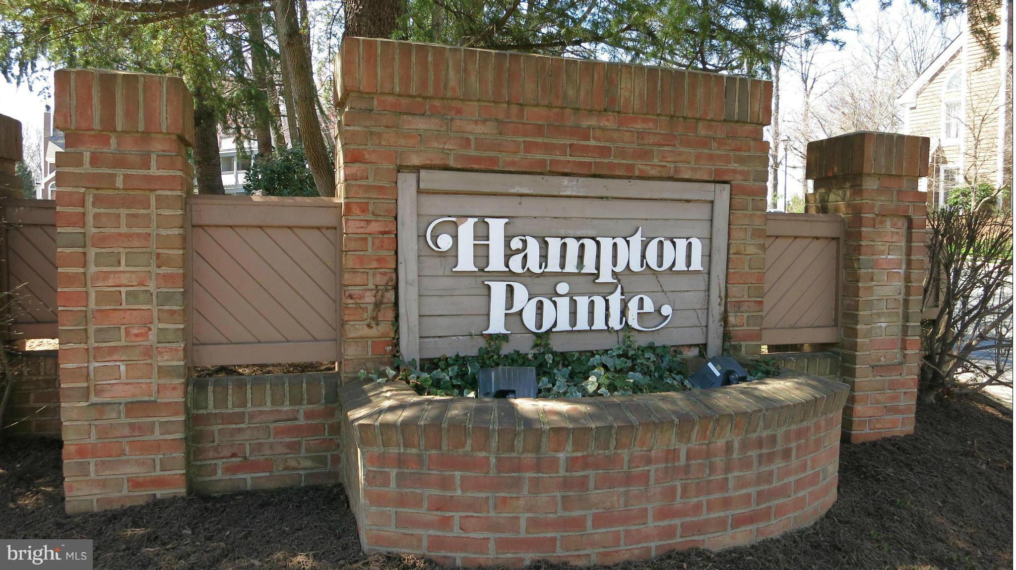 1423 Church Hill Place, Unit 1423 Reston, VA 20194 - Photo 22 of 26 a sign on the side of a building