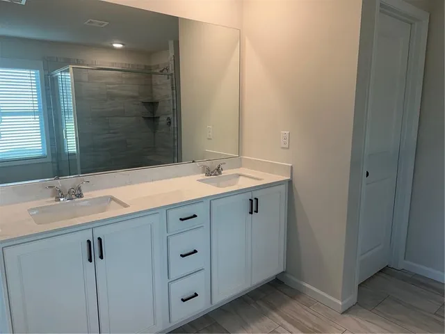 a white toilet sitting next to a sink