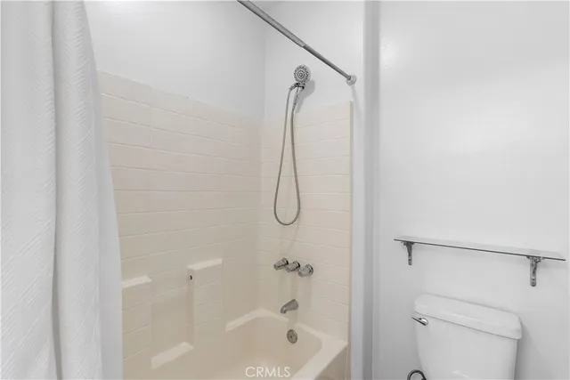 a bathroom with a bath tub and a shower