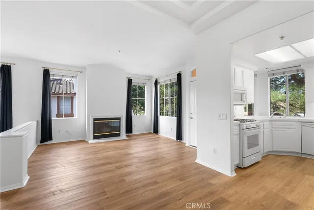 a view of a kitchen with a stove top oven
